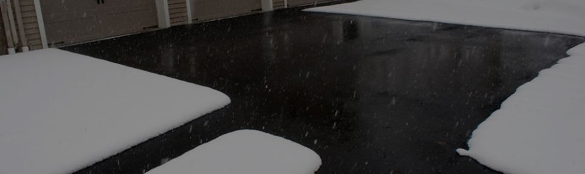A heated driveway operating during a snowstorm